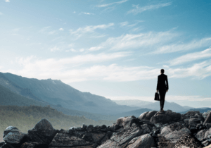 Man In A Suit Overlooking A Valley
