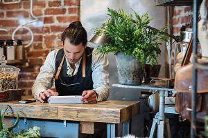 Small artisan business owner in shop